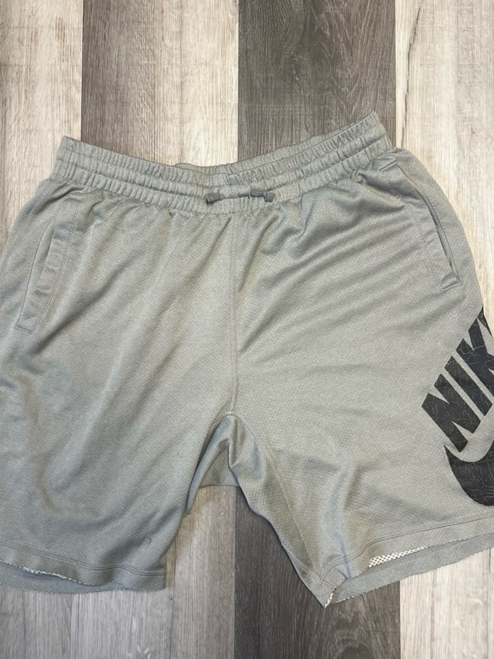 Nike Men's Gray Athletic Shorts with Black Logo